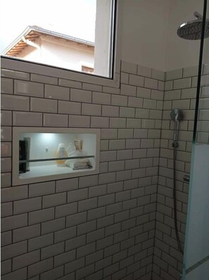 Shower, hair dryer, towels, toilet paper