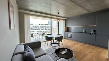 One Bedroom Apartment, Sea View | Living area | 55-inch Smart TV with digital channels, TV