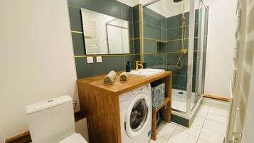 Shower, hair dryer, towels, soap