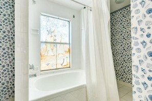 Bathtub, hair dryer, towels