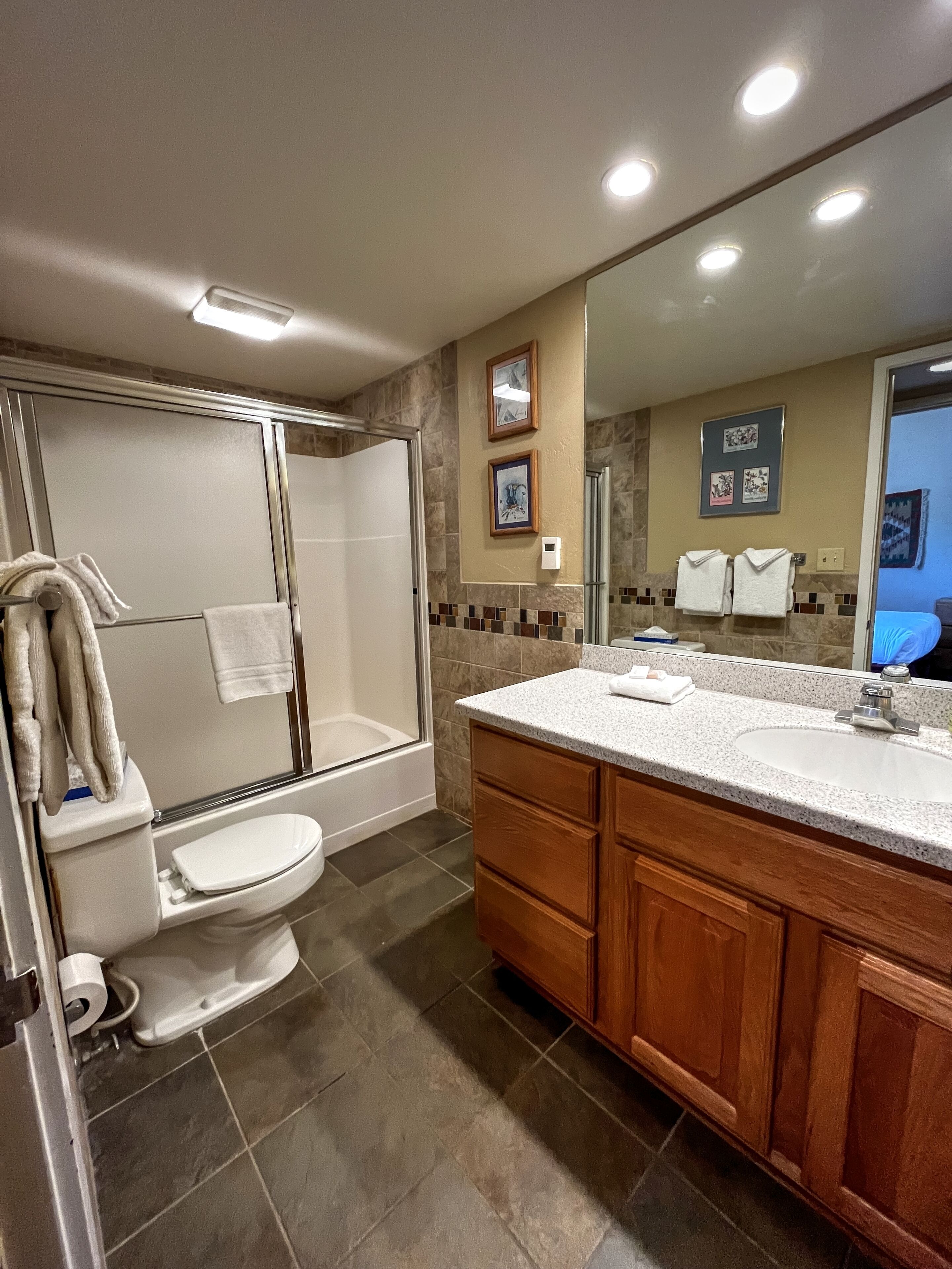 Combined shower/tub, hair dryer, towels, soap