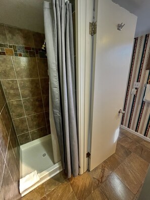 Combined shower/tub, hair dryer, towels, soap