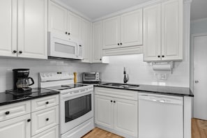 Dishwasher, coffee/tea maker, cookware/dishes/utensils