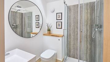 Shower, hair dryer, towels, toilet paper