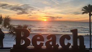 A sunset view with the word "Beach" in the foreground. - LIVE ON THE BEACH. Gulf Beach Front - Spectacular views. (Indian Shores)