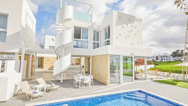 A modern building with a swimming pool, outdoor seating, and a spiral staircase. - Vie Bleu 15 - Three Bedroom Villa, Sleeps 6 (Πρωταράς)