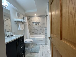 Combined shower/bathtub, hair dryer, towels, soap