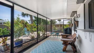 Relax in a serene outdoor space with a clear view of the surrounding landscape, featuring a seating area with a table and chairs.