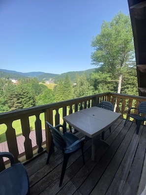 Relax on the deck with a view of the surrounding hills.