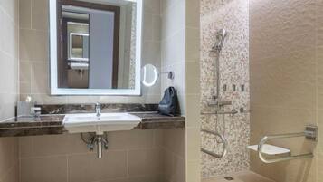 Business Studio Suite | Bathroom | Combined shower/tub, hair dryer, soap, shampoo