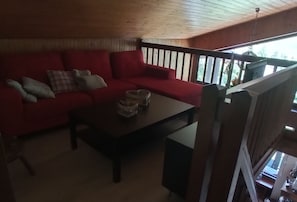 Relax in a comfortable living area with a sofa, coffee table, and decorative accents.