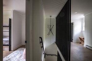 Experience a clean and bright atmosphere in this modern space with a balcony offering a view.