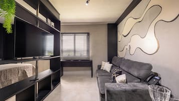 Luxury Apartment | Living area | 32-inch TV with cable channels