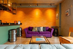 Senior Suite | Living area | 32-inch TV with digital channels