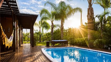 Outdoor pool, pool umbrellas, sun loungers