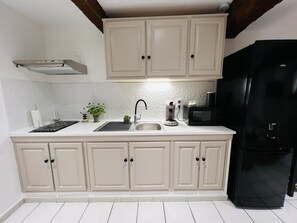 Fridge, microwave, stovetop, coffee/tea maker