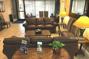 Relax in the stylish lobby, featuring a comfortable sofa, armchairs, and a coffee table.