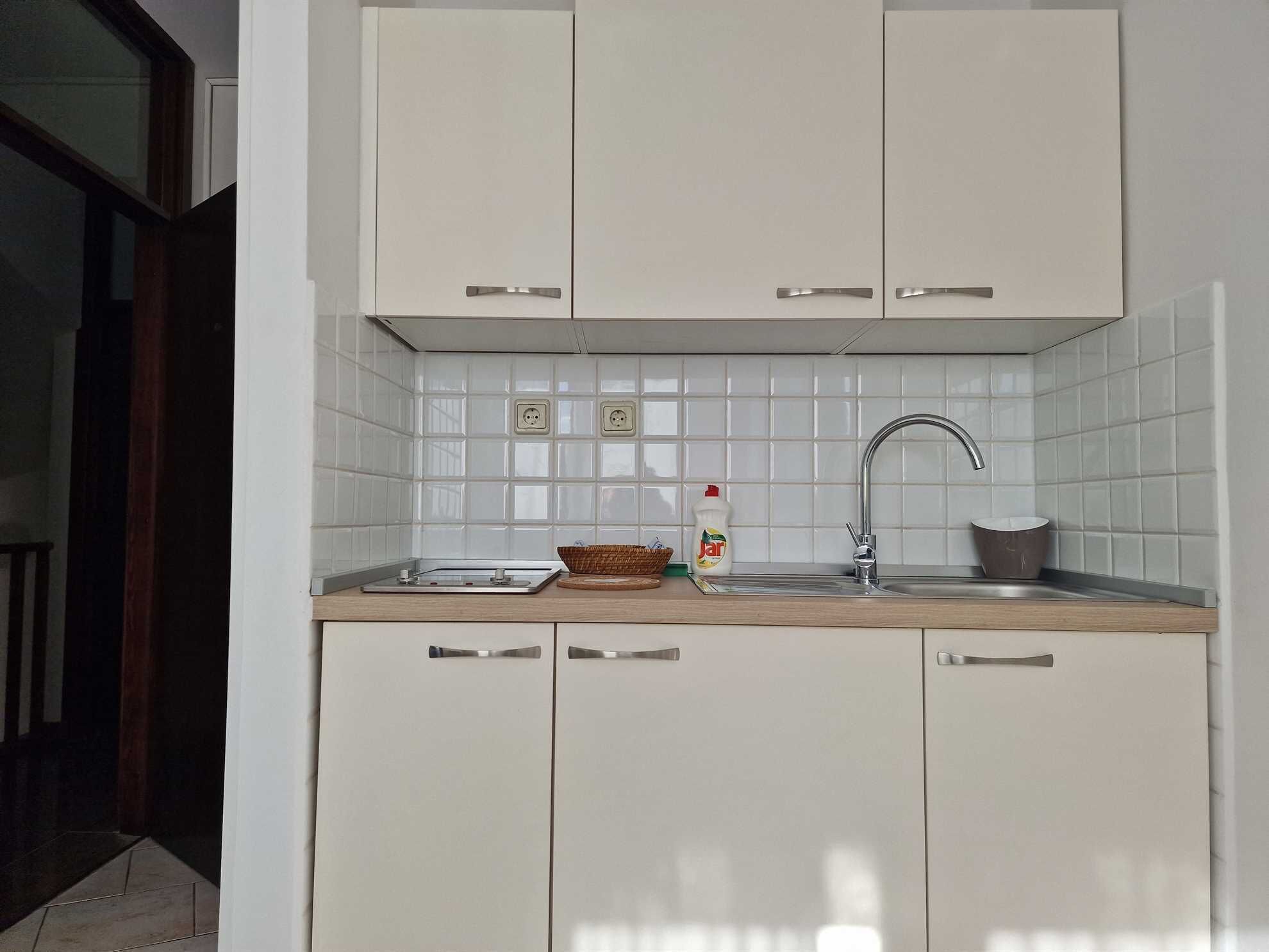 Fridge, stovetop, cookware/dishes/utensils, dining tables