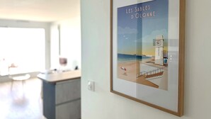 A framed artwork of a seaside scene with a clock tower, titled "Les Sables D'Olonne". - Renovated studio facing the main beach in Les Sables d'Olonne (Les Sables-d´Olonne)