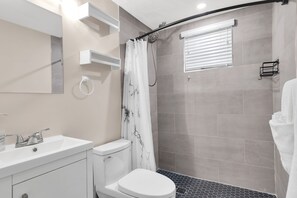 Shower, hair dryer, towels, soap