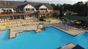 A hotel with a large pool, sun loungers, and outdoor seating areas. - GreatRoom, soaring ceilings, window walls,F/Place Just what you are looking for. (Bushkill)