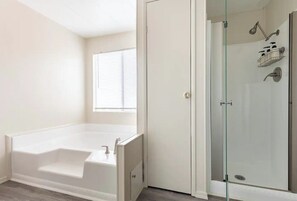 Combined shower/tub, hair dryer, towels, soap