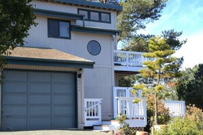 A two-story building with a garage, a balcony, and a small porch. - 2620 Merlyn Ave. Lodge Hill (Cambria)