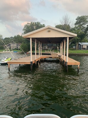 Guests can enjoy a serene dock experience with a flat roof and pillars.