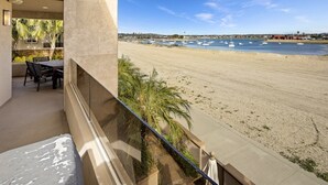 A balcony with a view of a sandy beach and the sea. - 3526 -Bayside Walk Unit  2 (San Diego)