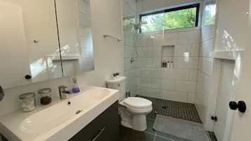 Bathtub, hair dryer, towels, soap