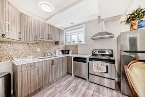 Fridge, microwave, oven, stovetop - 3 Bedroom Luxury Court Home in Nolan Hill (Calgary)