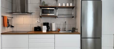 Fridge, microwave, stovetop, coffee/tea maker