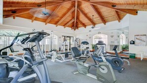 A gym with various exercise equipment, a wooden ceiling, and large windows. - Excellent location,Relax in the heart of the City (Phoenix)