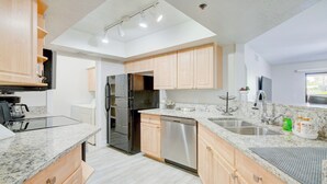 A modern kitchen with granite countertops, stainless steel appliances, and light wood cabinets. - Excellent location,Relax in the heart of the City (Phoenix)