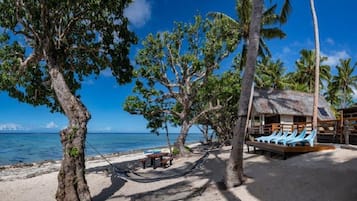 On the beach, sun-loungers, beach towels