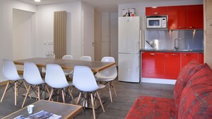 A modern kitchen with red cabinets, a white refrigerator, and a microwave. - Renovated cozy apartment near slopes, 3 rooms + cabin for 8 people, pets allowed (Plagne Bellecôte)