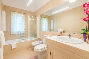 Bathtub, hair dryer, towels