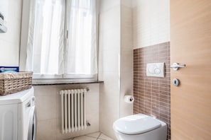 Bathtub, hair dryer, bidet