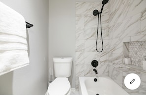 Combined shower/tub, hair dryer, towels - A home away from home with Uniqueness (Sugar Land)