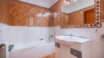 Bathtub, hair dryer, towels