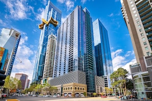 Standing tall in the heart of the city, this building offers a striking architectural design with a unique angular structure.