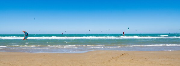 Private beach, white sand, sun-loungers, beach umbrellas