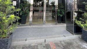 The entrance to a building with a glass facade and the name "ONE EUPHORIA" above the doors. - Luxurious 1 Bedroom King Bed Skyline View Walking Street Condo (Angeles)