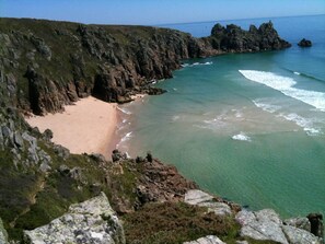 A coastal landscape with a sandy beach, rocky cliffs, and clear blue waters. - Sancreed Beacon Heart of West Cornwall - Sea Views (Penzance)