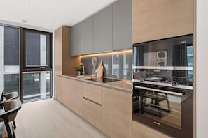 Apartment (2 Bedrooms) | Private kitchen | Fridge, microwave, oven, stovetop