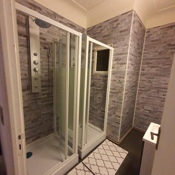 Shower, hair dryer, towels, soap