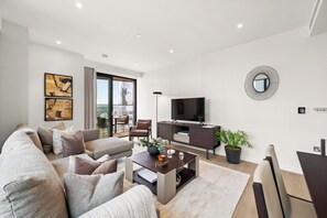 Apartment (2 Bedrooms) | Living area | 24-inch TV with digital channels