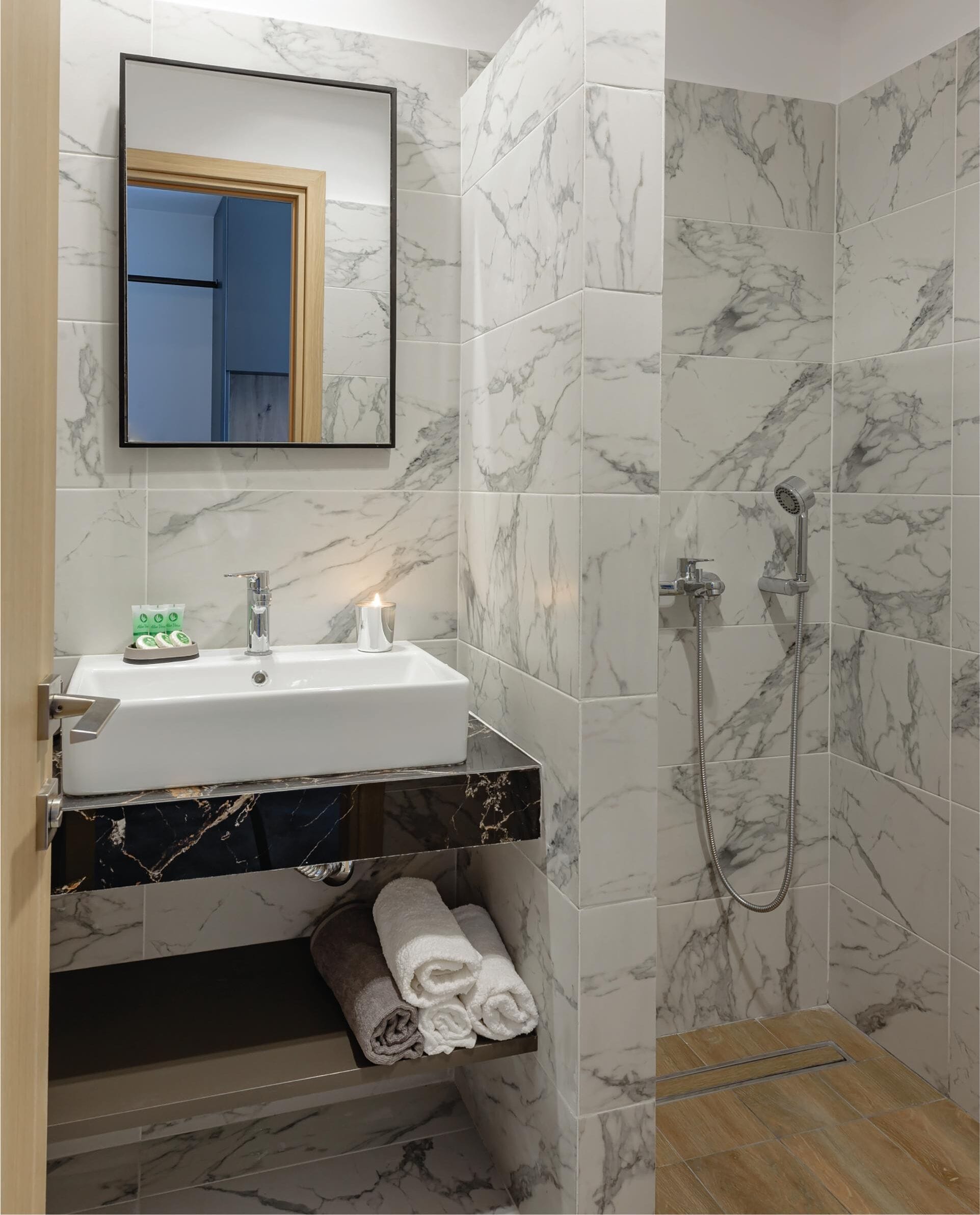 shower, rainfall showerhead, hair dryer, towels