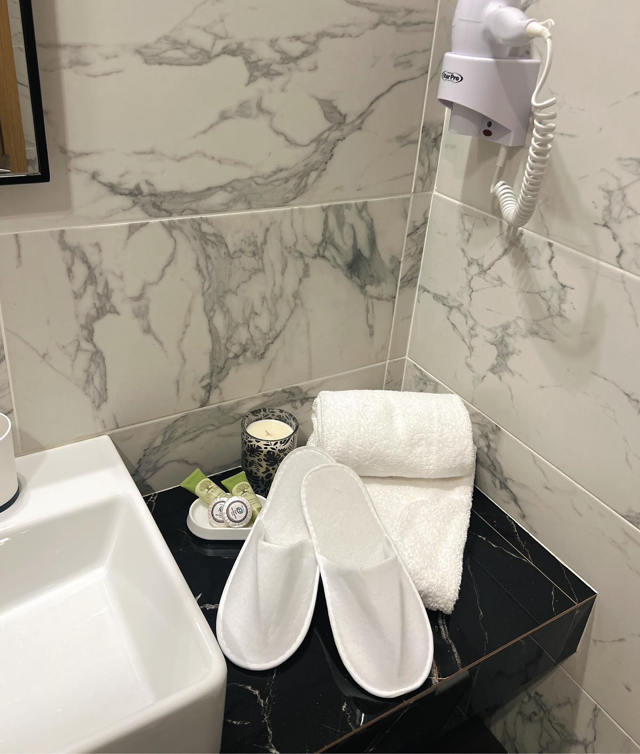 shower, rainfall showerhead, hair dryer, towels