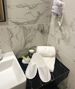 Shower, rainfall showerhead, hair dryer, towels